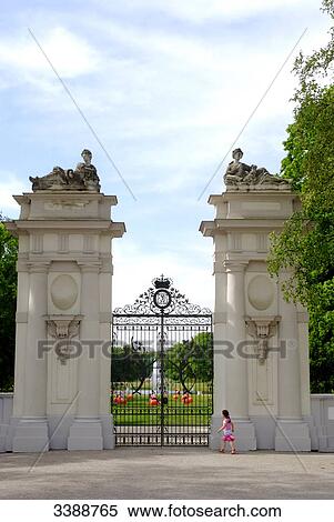 Girl in front of the gate to the palace garden of the Oranienburg Palace, Germany View Large Photo Image Stock Photography - Girl in front of the gate to the palace garden of the Oranienburg Palace, Germany . Fotosearch