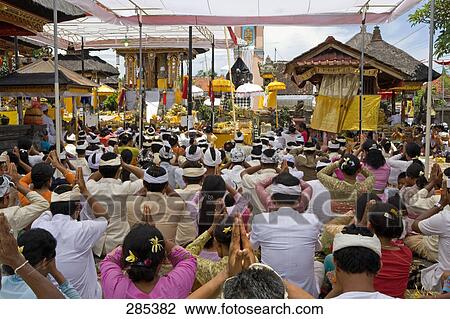 Group of native balinese people making religious offering during ceremony, Bali, Indonesia View Large Photo Image Stock Image - Group of native balinese people making religious offering during ceremony, Bali, Indonesia . Fotosearch