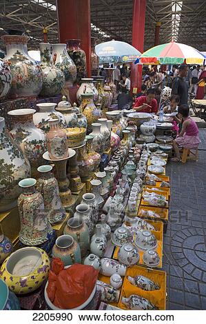 Group of people at market of ceramic vases View Large Photo Image Stock Image - Group of people at market of ceramic vases . Fotosearch