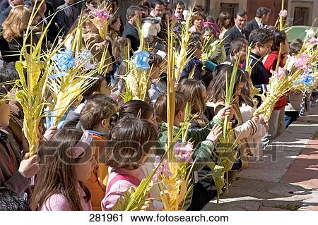 Stock Image - Group of people participating in Easter celebration, Sicily, Italy . Fotosearch
