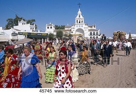 Group of people walking in traditional festival, Pentecost pilgrimage, El Rocie, Huelva, Andalusia, Spain View Large Photo Image Stock Photography - Group of people walking in traditional festival, Pentecost pilgrimage, El Rocie, Huelva, Andalusia, Spain . Fotosearch
