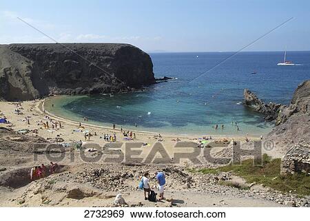 Group of tourists on beach View Large Photo Image Stock Photo - Group of tourists on beach . Fotosearch