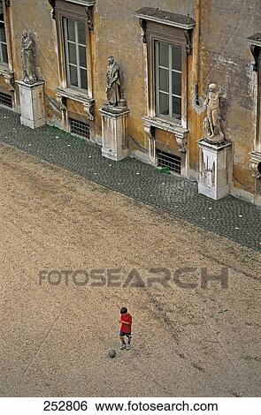 High angel view of boy playing soccer, Villa Medici, Rome, Italy View Large Photo Image Stock Photograph - High angel view of boy playing soccer, Villa Medici, Rome, Italy . Fotosearch