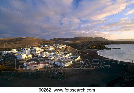 High angle view of a town on the coast, Playa De Los Muertos, Ajuy, Fuerteventura, Canary Islands, Spain View Large Photo Image Stock Image - High angle view of a town on the coast, Playa De Los Muertos, Ajuy, Fuerteventura, Canary Islands, Spain . Fotosearch