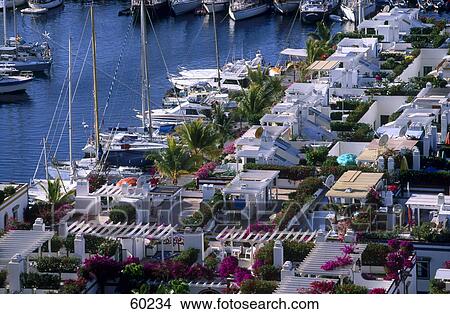 High angle view of houses and boats at the seaside, Puerto de Mogan, Gran Canaria, Canary Islands, Spain View Large Photo Image Picture - High angle view of houses and boats at the seaside, Puerto de Mogan, Gran Canaria, Canary Islands, Spain . Fotosearch
