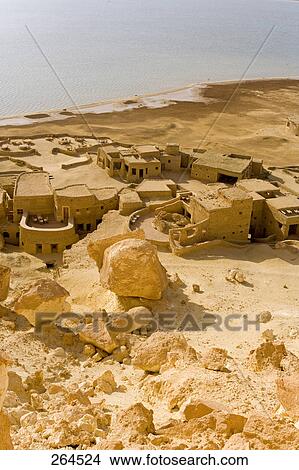 Picture - High angle view of old ruins of resort at waterfront, Adrere Amellal, Inland lake, Siwa Oasis, Libyan Desert, Egypt . Fotosearch