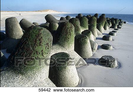 Stock Image - High angle view of rocks on sand . Fotosearch