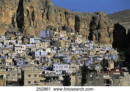 Stock Image - High angle view of town at hillside . Fotosearch