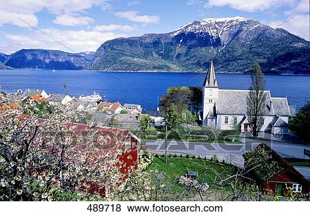 Houses at waterfront with mountain in background View Large Photo Image Stock Photo - Houses at waterfront with mountain in background . Fotosearch