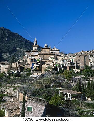 Stock Photograph - Houses in village on hill, Valldemossa, Majorca, Balearic Islands, Spain . Fotosearch