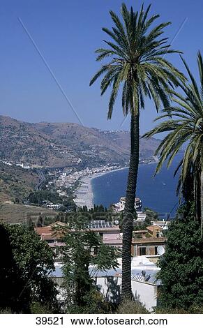 Stock Image - Houses on coast, Taormina, Sicily, Italy . Fotosearch