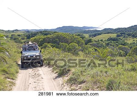 Jeep moving through dirt road, Greater St. Lucia Wetland Park, South Africa View Large Photo Image Stock Image - Jeep moving through dirt road, Greater St. Lucia Wetland Park, South Africa . Fotosearch