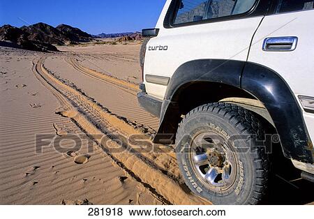 Jeep parked in desert, Sinai Desert, Egypt View Large Photo Image Stock Photo - Jeep parked in desert, Sinai Desert, Egypt . Fotosearch