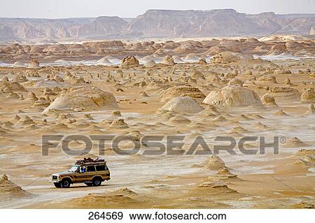 Jeep traveling through desert, Siwa Oasis, Libyan Desert, Egypt View Large Photo Image Stock Photo - Jeep traveling through desert, Siwa Oasis, Libyan Desert, Egypt . Fotosearch