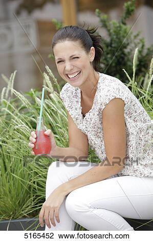 Junge Frau trinkt Limo View Large Photo Image Stock Image - Junge Frau trinkt Limo . Fotosearch