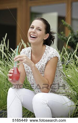 Junge Frau trinkt Limo View Large Photo Image Stock Photo - Junge Frau trinkt Limo . Fotosearch