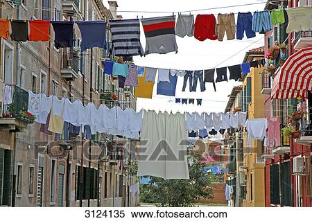 Laundry drying on clotheslines between two buildings, Giudecca, Venice, Italy, low angle view View Large Photo Image Stock Photography - Laundry drying on clotheslines between two buildings, Giudecca, Venice, Italy, low angle view . Fotosearch