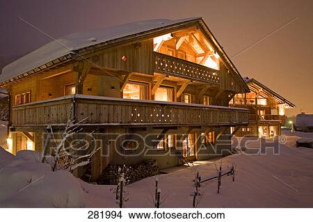 Lodge lit up at dusk, Lodge Montagnard, Haute-Savoie, Chalet, France View Large Photo Image Picture - Lodge lit up at dusk, Lodge Montagnard, Haute-Savoie, Chalet, France . Fotosearch