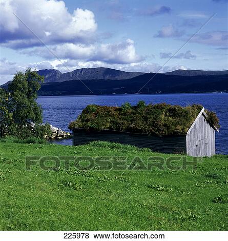 Stock Photo - Log cabin at lakeside, Norway . Fotosearch