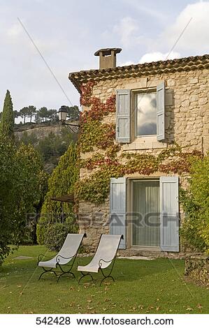 Lounge chairs in front of hotel, La Bastide De Marie, Menerbes, Luberon, Vaucluse, Provence-Alpes-Cote d'Azur, France View Large Photo Image Stock Photo - Lounge chairs in front of hotel, La Bastide De Marie, Menerbes, Luberon, Vaucluse, Provence-Alpes-Cote d'Azur, France . Fotosearch