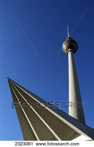 Stock Image - Low angle view of communication tower against clear blue sky, Berlin, Germany . Fotosearch