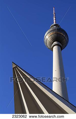 Stock Image - Low angle view of communication tower against clear blue sky, Berlin, Germany . Fotosearch