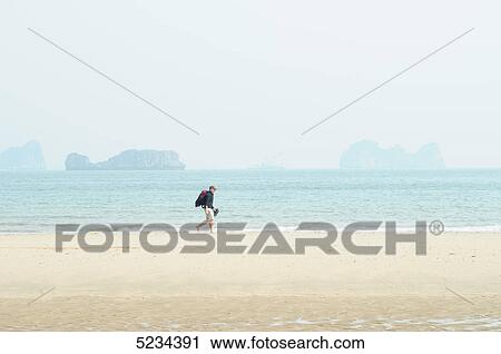 Man at beach, Mui Ne, Vietnam, Asia View Large Photo Image Stock Image - Man at beach, Mui Ne, Vietnam, Asia . Fotosearch