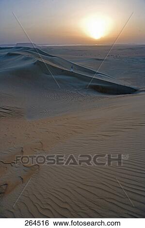 Man in sand dune, Siwa Oasis, Libyan Desert, Egypt View Large Photo Image Stock Photograph - Man in sand dune, Siwa Oasis, Libyan Desert, Egypt . Fotosearch