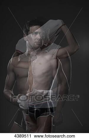 Man removing shirt View Large Photo Image Stock Image - Man removing shirt . Fotosearch