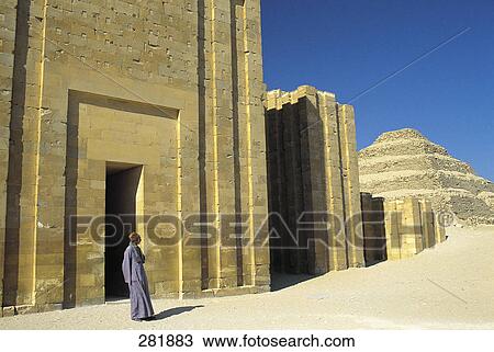 Man standing in front of old ruins View Large Photo Image Stock Image - Man standing in front of old ruins . Fotosearch
