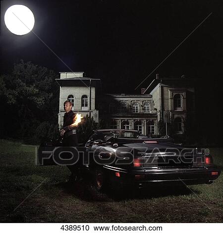 Man with burning arm getting out of car View Large Photo Image Stock Image - Man with burning arm getting out of car . Fotosearch