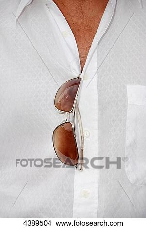 Man with chest hair, white shirt and sunglasses, mid section View Large Photo Image Picture - Man with chest hair, white shirt and sunglasses, mid section . Fotosearch