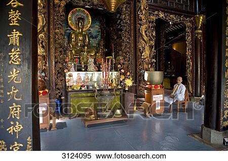 Mann sitting beside an altar in a buddhist temple, Vietnam View Large Photo Image Stock Photography - Mann sitting beside an altar in a buddhist temple, Vietnam . Fotosearch