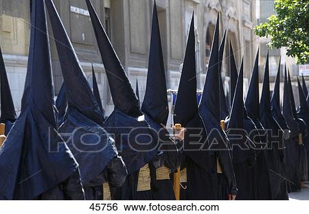 Masked men in holy week procession, Semana Santa, Seville, Andalucia, Spain View Large Photo Image Stock Photograph - Masked men in holy week procession, Semana Santa, Seville, Andalucia, Spain . Fotosearch