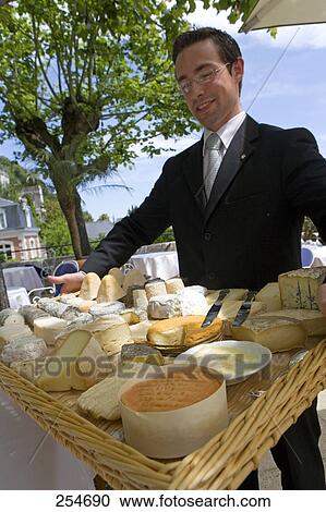 Mid adult man with different cheese in wicker tray View Large Photo Image Stock Image - Mid adult man with different cheese in wicker tray . Fotosearch