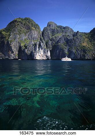 Motorboat in sea near coast, Phi Phi Island, Thailand View Large Photo Image Stock Photography - Motorboat in sea near coast, Phi Phi Island, Thailand . Fotosearch