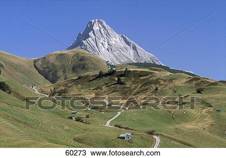 Mountain peak against blue sky, Biberkopf Mountain, Tirol, Austria View Large Photo Image Stock Image - Mountain peak against blue sky, Biberkopf Mountain, Tirol, Austria . Fotosearch