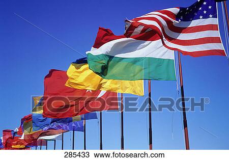 National flags of different countries fluttering against sky, Lido, Venice, Italy View Large Photo Image Stock Image - National flags of different countries fluttering against sky, Lido, Venice, Italy . Fotosearch