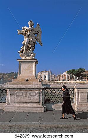 Nun walking near statue, Basilica Of St. John Lateran, Rome, Italy View Large Photo Image Stock Photo - Nun walking near statue, Basilica Of St. John Lateran, Rome, Italy . Fotosearch