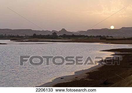 Oasis in desert at dusk, Siwa Oasis, Libyan Desert, Egypt View Large Photo Image Stock Image - Oasis in desert at dusk, Siwa Oasis, Libyan Desert, Egypt . Fotosearch