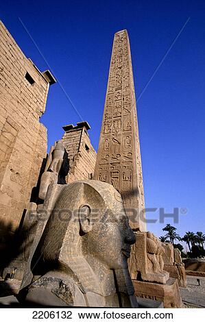 Obelisk and statue against sky, Luxor, Egypt View Large Photo Image Stock Image - Obelisk and statue against sky, Luxor, Egypt . Fotosearch