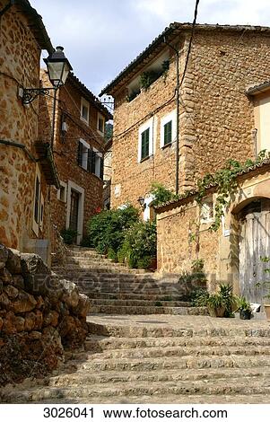 Old houses along a staircase in an alley, Fornalutx, Majorca, Spain, low angle view View Large Photo Image Stock Image - Old houses along a staircase in an alley, Fornalutx, Majorca, Spain, low angle view . Fotosearch