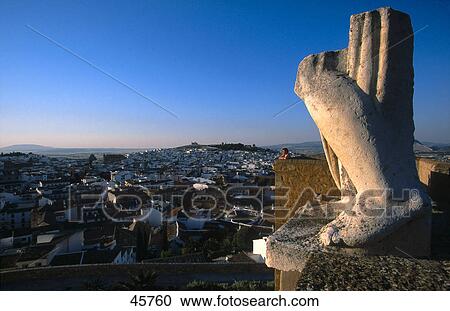 Old ruins of statue overlooking city, Antequera, Arco de Gigantes, Andalusia, Spain View Large Photo Image Stock Image - Old ruins of statue overlooking city, Antequera, Arco de Gigantes, Andalusia, Spain . Fotosearch