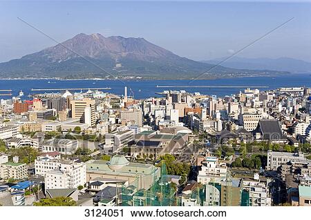 Overview on city of Kagoshima, volcano Sakurajima at back, Japan, aerial perspective View Large Photo Image Stock Image - Overview on city of Kagoshima, volcano Sakurajima at back, Japan, aerial perspective . Fotosearch