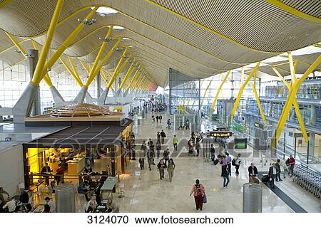 Stock Image - People at an airport terminal, Madrid, Spain, high angle view . Fotosearch