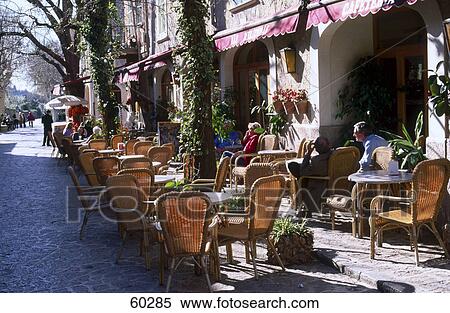 People at outdoor cafe, Valldemossa Street, Balearic Islands, Spain View Large Photo Image Stock Photography - People at outdoor cafe, Valldemossa Street, Balearic Islands, Spain . Fotosearch