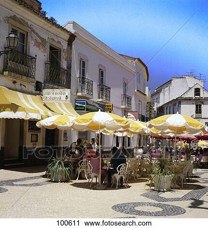 People at sidewalk cafe, Algarve, Portugal View Large Photo Image Stock Image - People at sidewalk cafe, Algarve, Portugal . Fotosearch