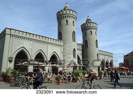 Stock Image - People at sidewalk cafe, Nauener Gate, Potsdam, Brandenburg, Germany . Fotosearch