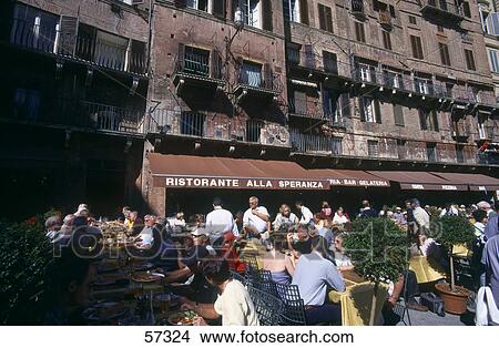 Picture - People at sidewalk cafe, Piazza Del Campo, Siena, Tuscany, Italy . Fotosearch