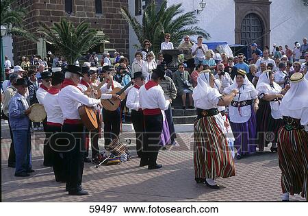 People looking at folk dancers performance, Teguise, Lanzarote, Canary Islands, Spain View Large Photo Image Stock Photo - People looking at folk dancers performance, Teguise, Lanzarote, Canary Islands, Spain . Fotosearch